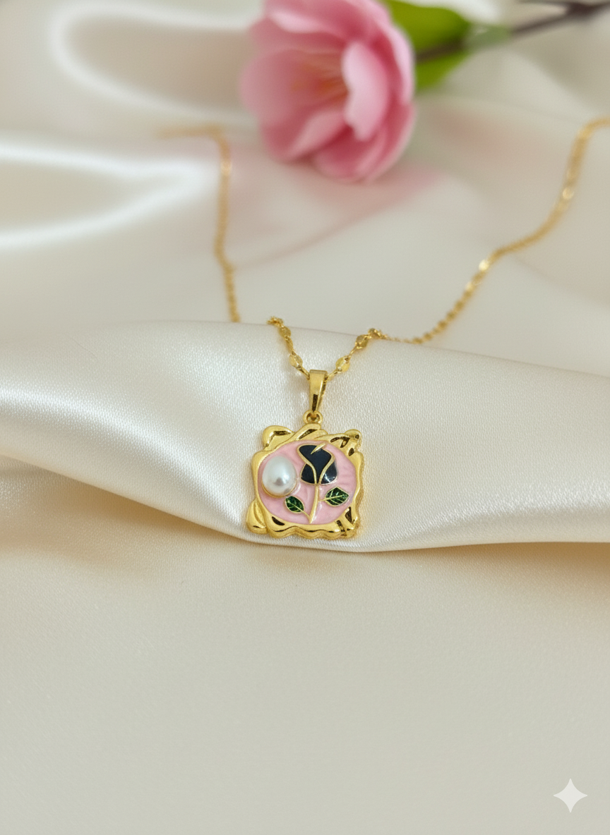 Gold necklace with a decorative pendant on a soft fabric background