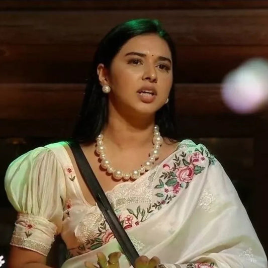 Woman in traditional attire with pearl Necklace
