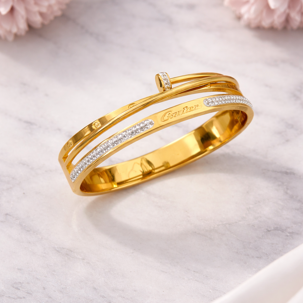 Gold bracelet with diamonds on a light background