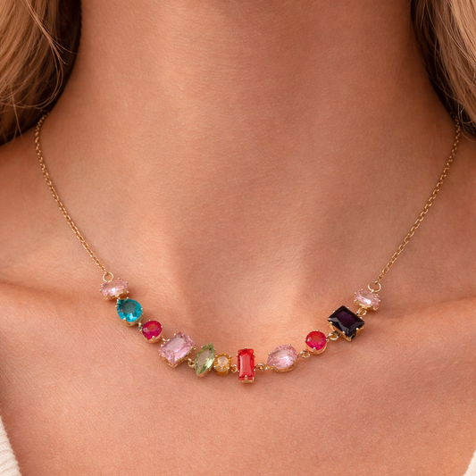 Necklace with colorful beads on a person wearing a white top