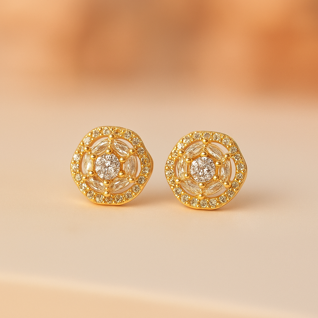 Gold earrings with gemstones on a beige background
