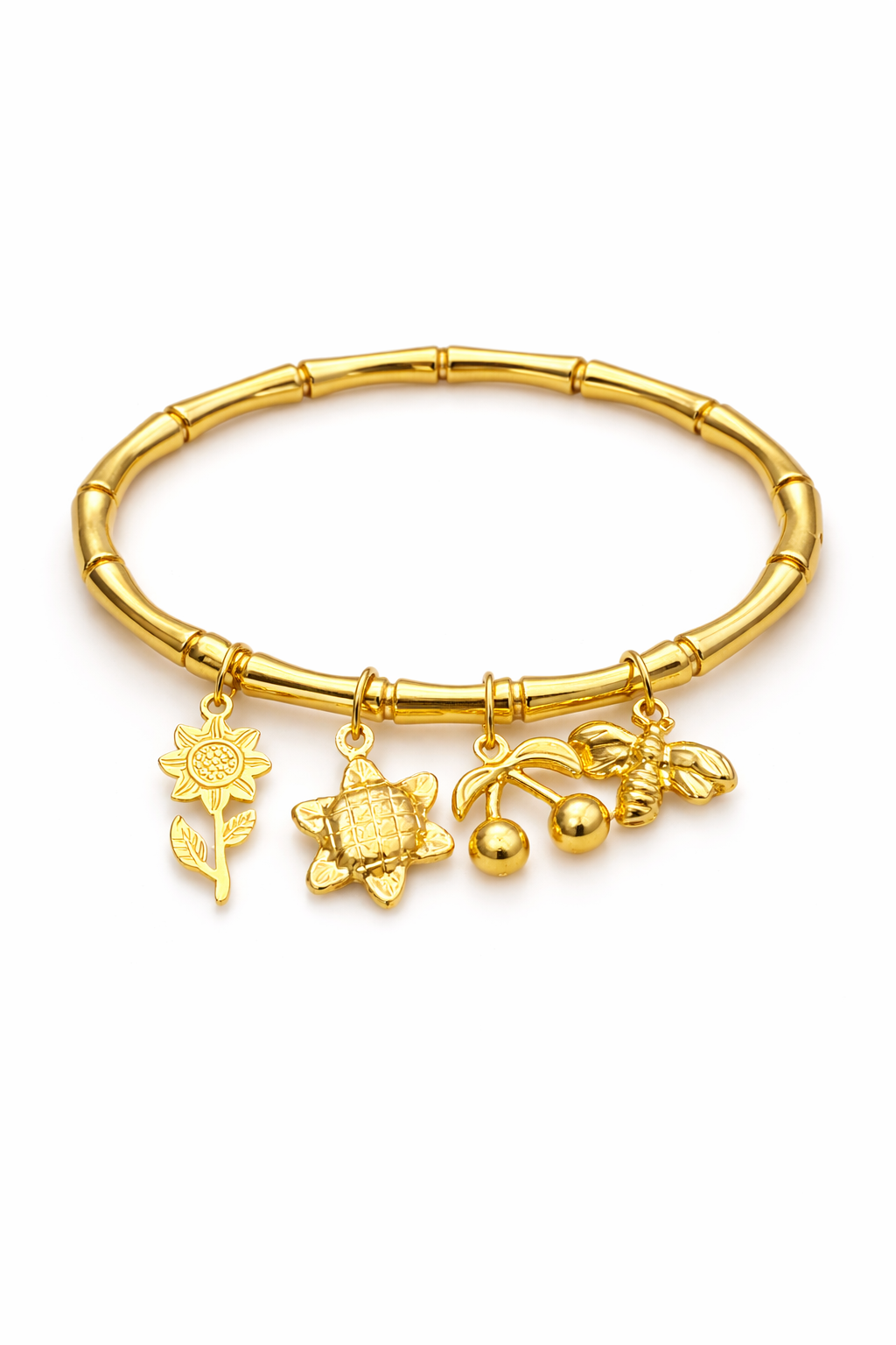 Gold bracelet with charms on a white background