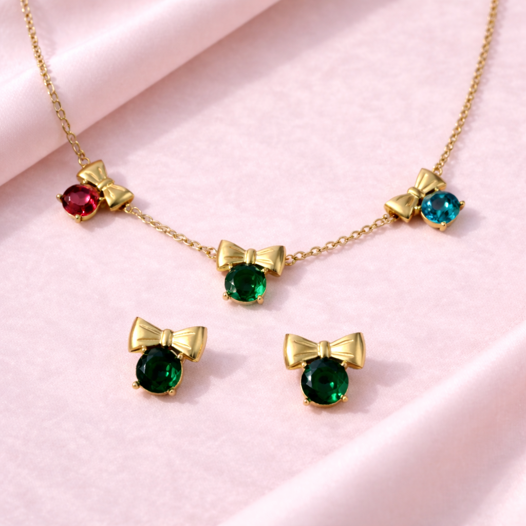 Jewelry set with necklaces and earrings featuring colorful gemstones on a pink background