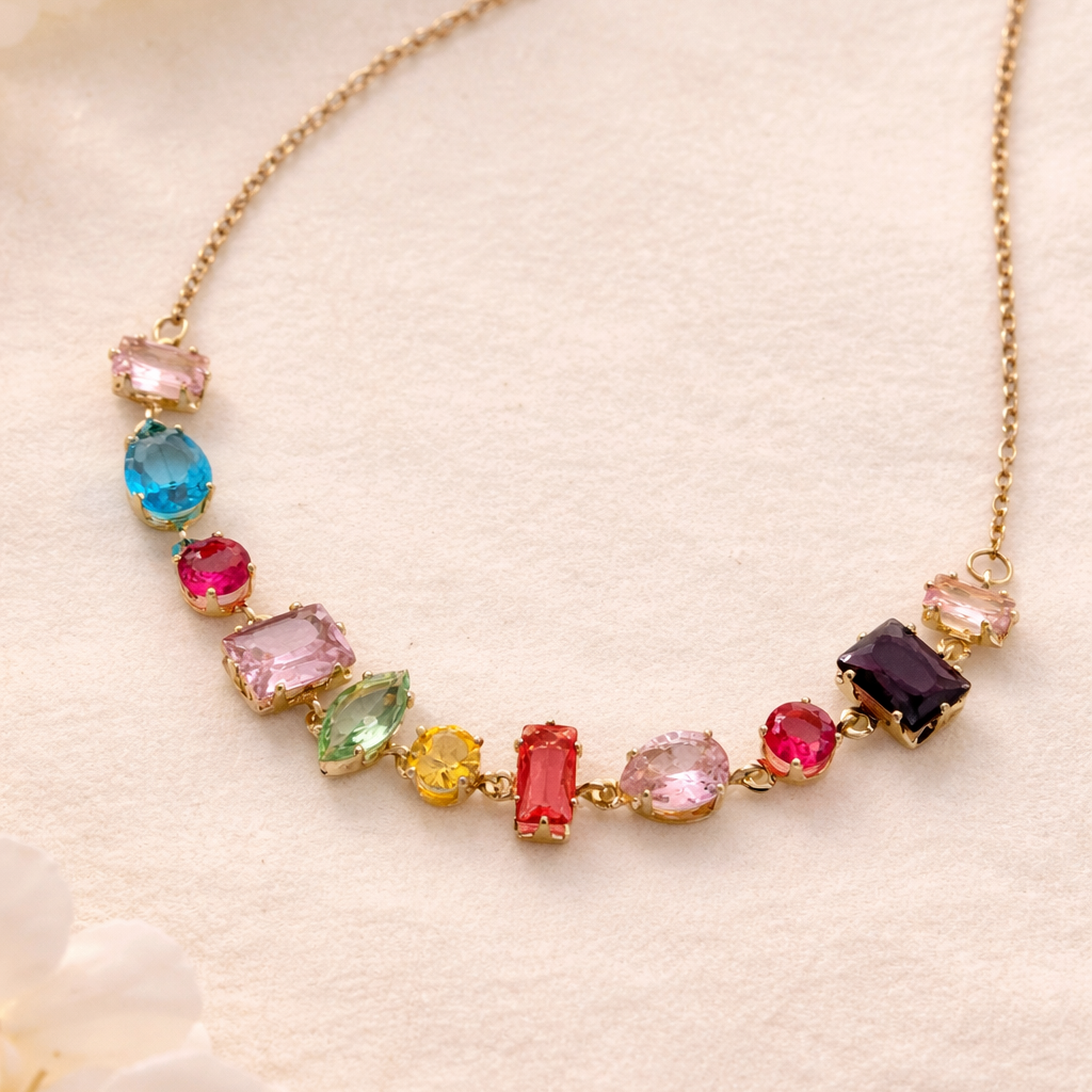 Necklace with multicolored gemstones on a light background