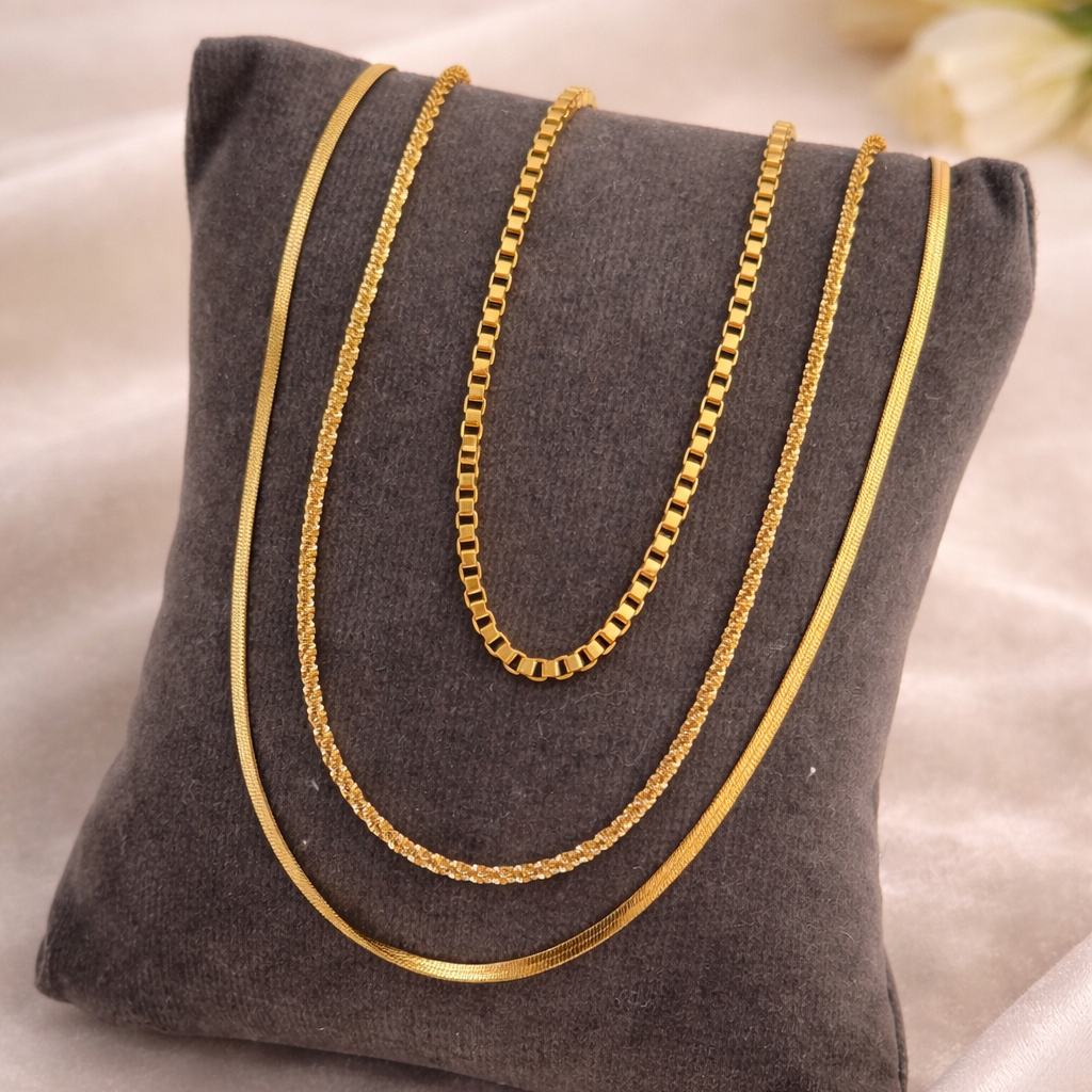 Gold chain on a gray pillow with a soft background