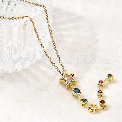 Gold necklace with colorful gemstones on a white background