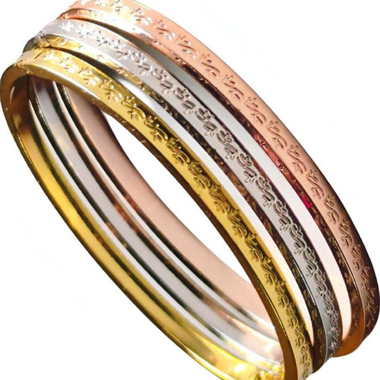 Three gold rings in different colors on a white background